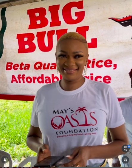A foundation volunteer at a community outreach stand